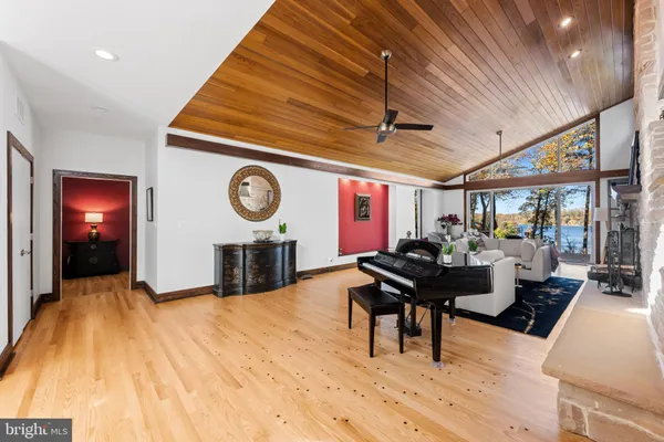 a living room with fireplace furniture and a fireplace