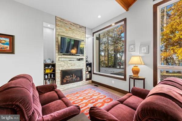 a spacious bedroom with a bed and large window