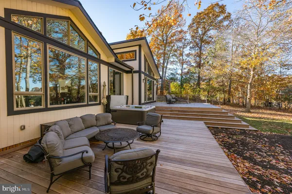 an aerial view of a house with yard swimming pool and outdoor seating