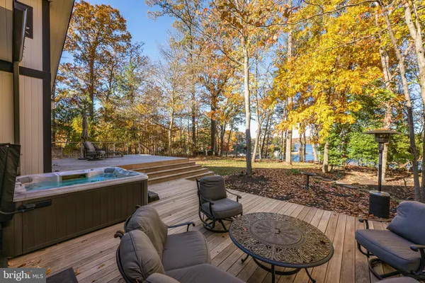 a view of outdoor space with deck and tree