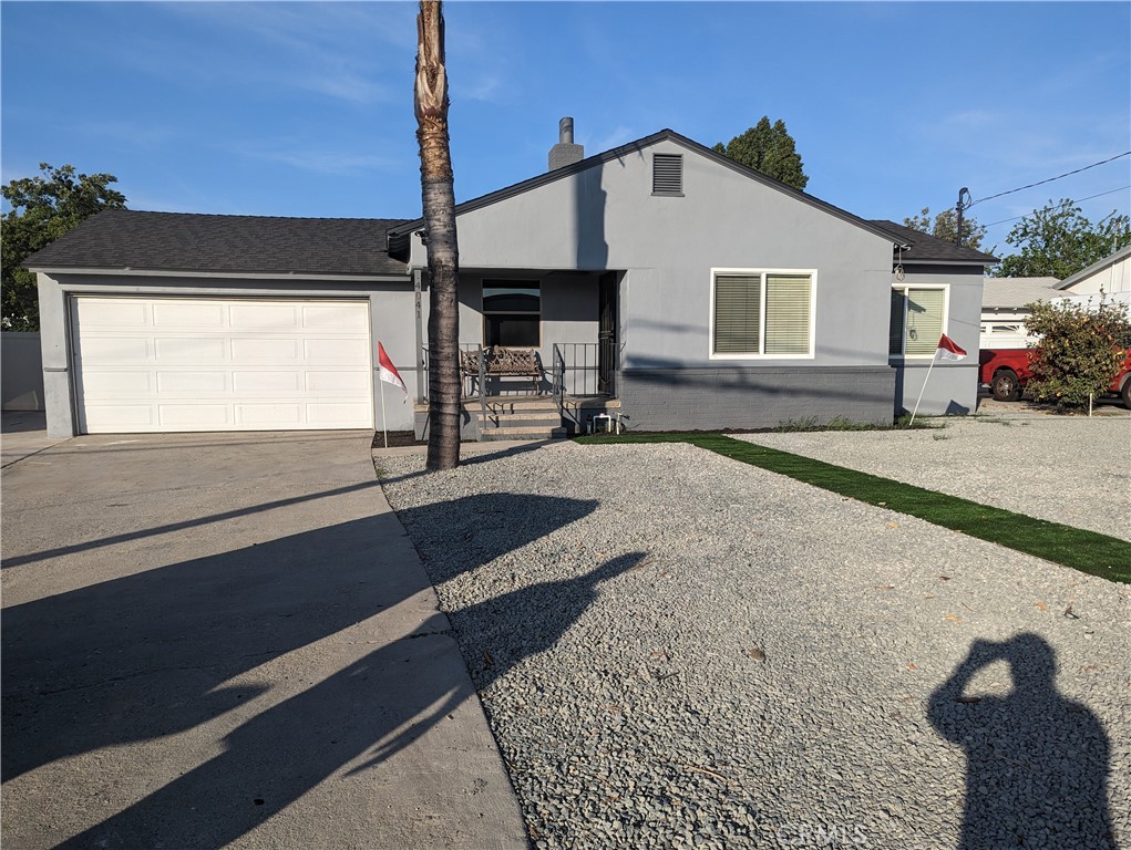 4041 Madison Street Riverside, CA 92504 - Photo 1 of 1 a front view of a house with garage