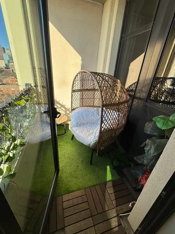 a view of balcony with furniture