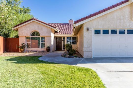 1217 Flora Way Ridgecrest, CA 93555 - Photo 3 of 39 a view of a house with backyard and sitting area