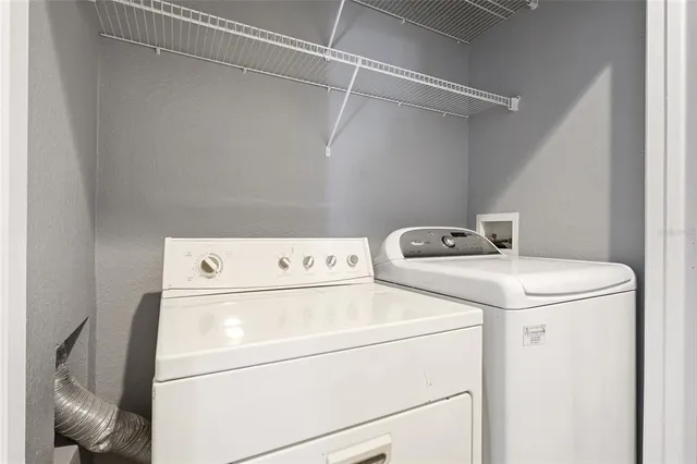 a utility room with dryer and washer