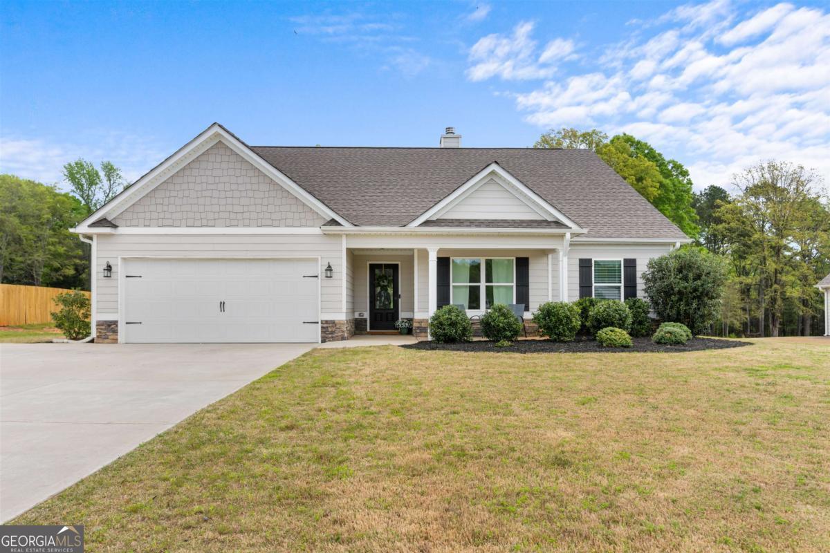 a front view of a house with yard