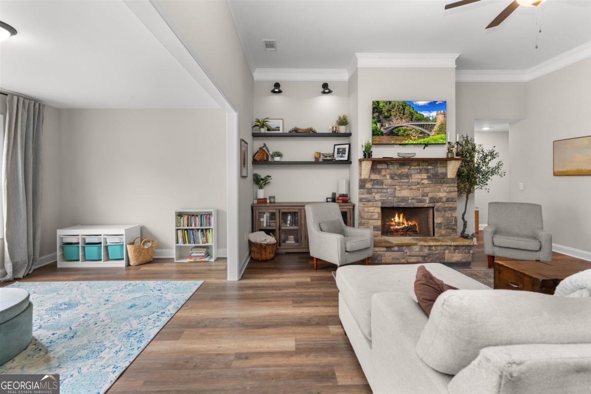 187 Loch Way Eatonton, GA 31024 - Photo 19 of 49 a living room with furniture and a fireplace