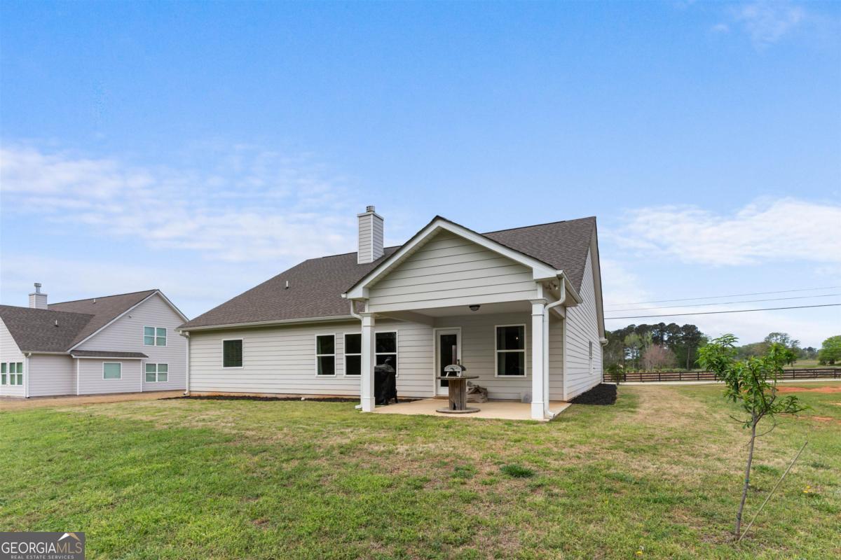 187 Loch Way Eatonton, GA 31024 - Photo 30 of 49 a front view of a house with a garden