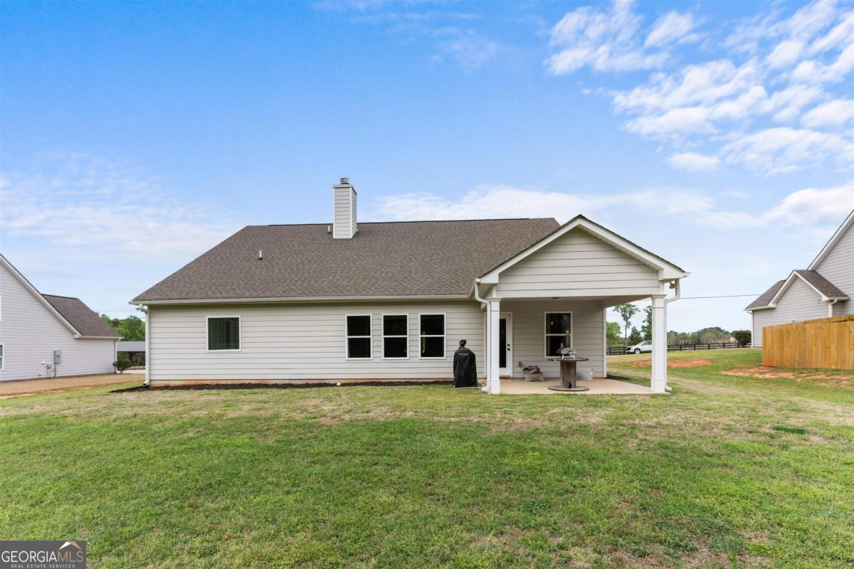 187 Loch Way Eatonton, GA 31024 - Photo 32 of 49 a front view of house with yard and green space