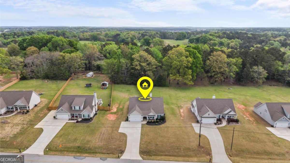 187 Loch Way Eatonton, GA 31024 - Photo 33 of 49 an aerial view of a swimming pool with seating space