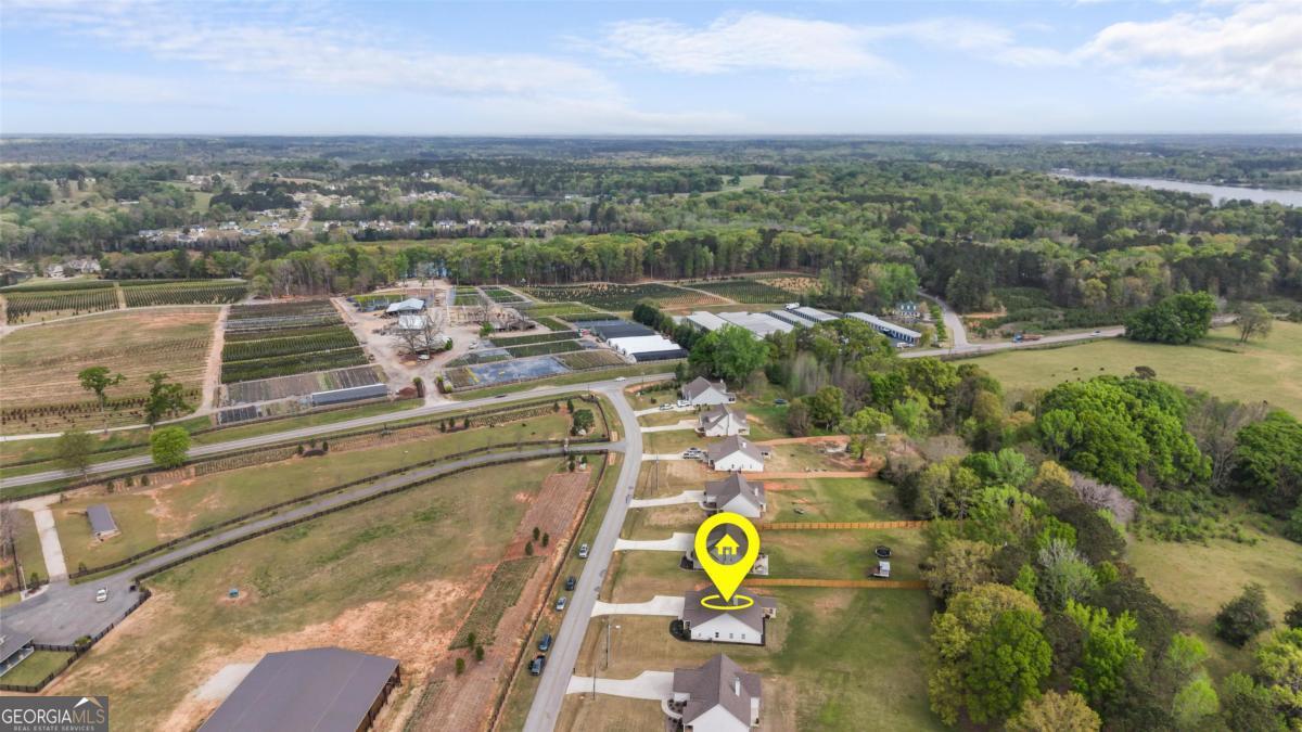 187 Loch Way Eatonton, GA 31024 - Photo 36 of 49 an aerial view of a house with a swimming pool