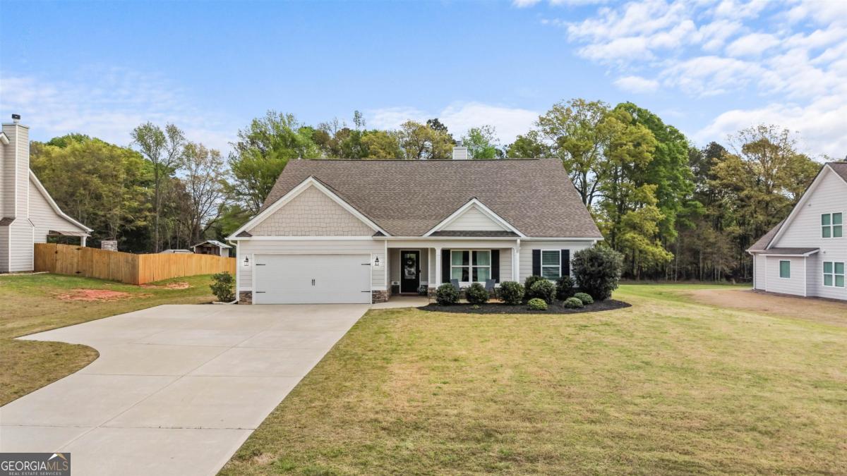 187 Loch Way Eatonton, GA 31024 - Photo 38 of 49 front view of a house with a yard