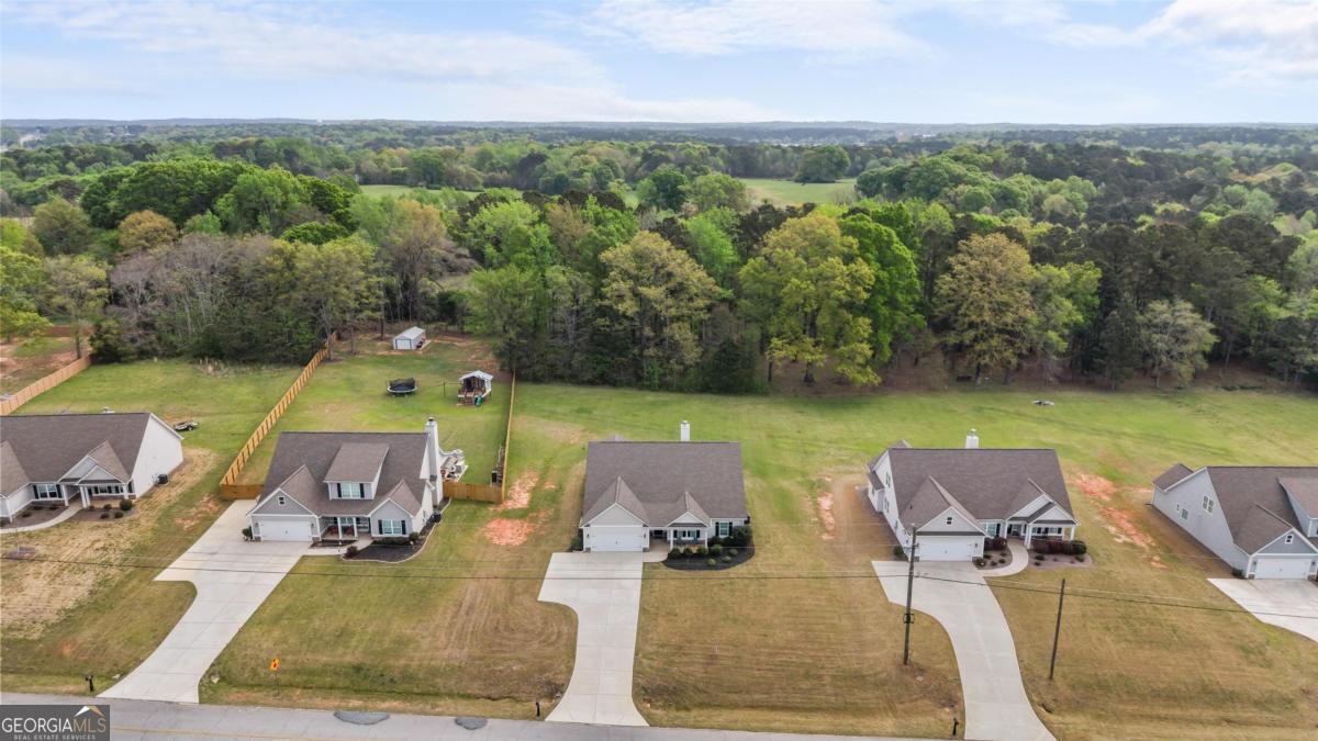 187 Loch Way Eatonton, GA 31024 - Photo 44 of 49 an aerial view of a chairs and table on the patio