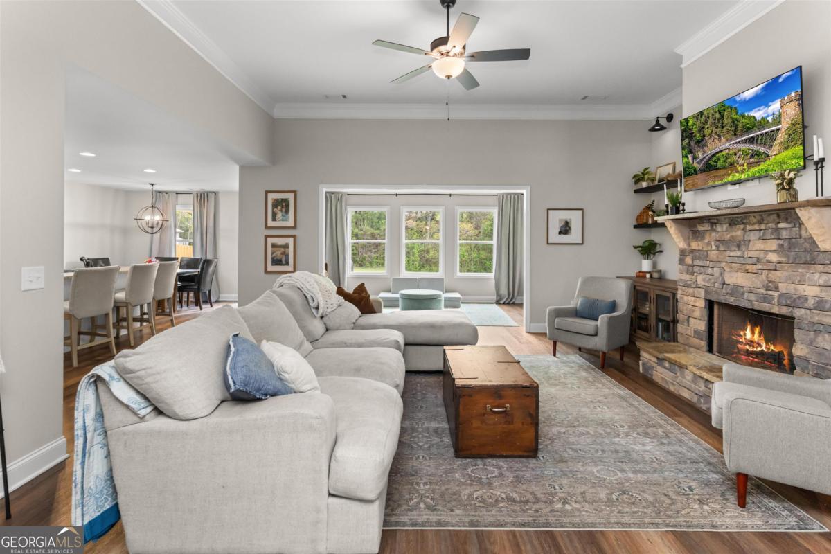 187 Loch Way Eatonton, GA 31024 - Photo 6 of 49 a living room with furniture and a fireplace