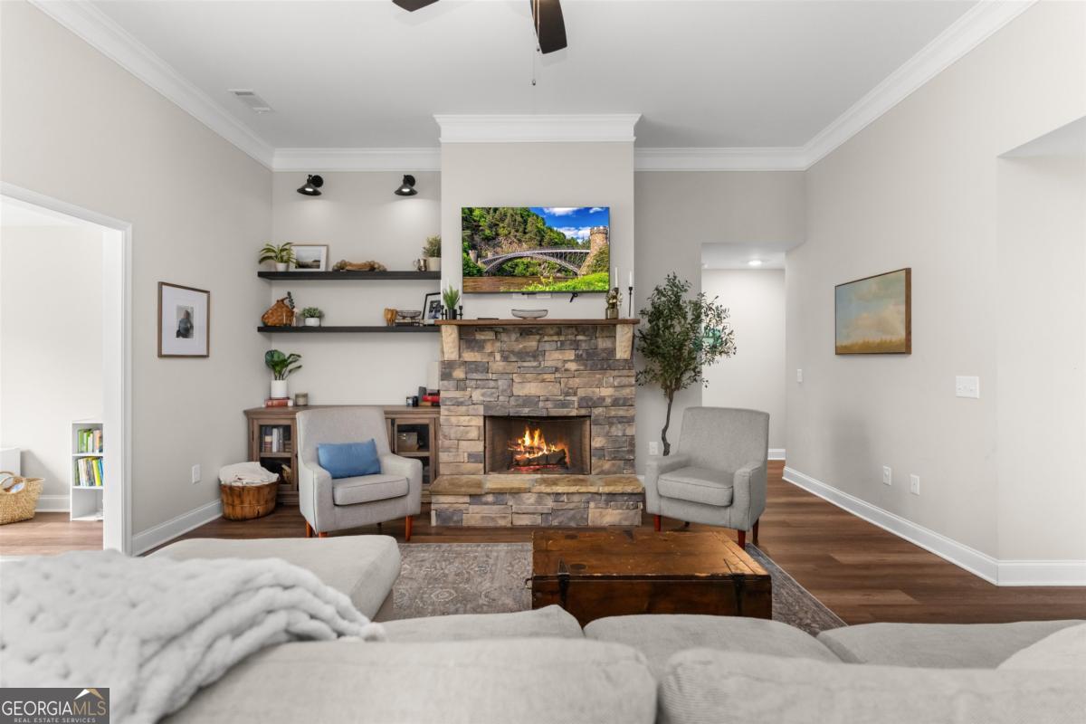 187 Loch Way Eatonton, GA 31024 - Photo 8 of 49 a living room with furniture and a fireplace