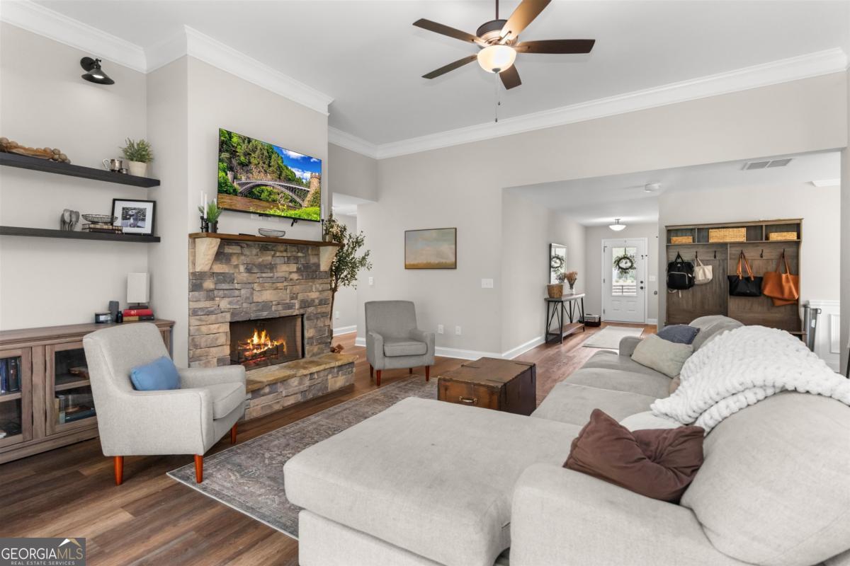 187 Loch Way Eatonton, GA 31024 - Photo 9 of 49 a living room with furniture and a fireplace