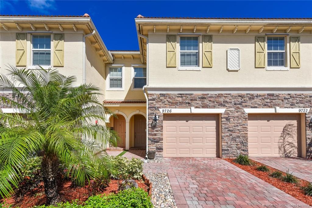 9726 Southwest Purple Martin Way Stuart, FL 34997 - Photo 1 of 30 a front view of a building