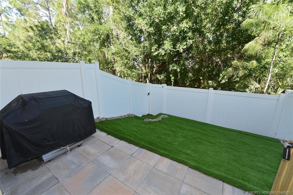 9726 Southwest Purple Martin Way Stuart, FL 34997 - Photo 13 of 30 a view of a back yard