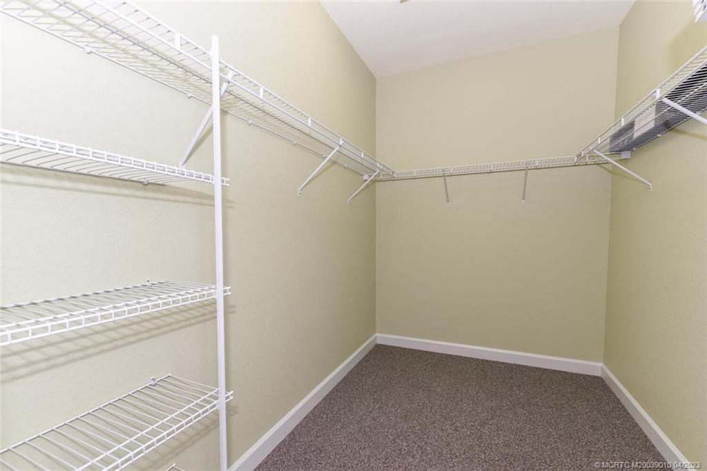 9726 Southwest Purple Martin Way Stuart, FL 34997 - Photo 17 of 30 a view of a room with racks on the wall