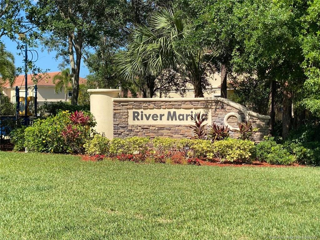 9726 Southwest Purple Martin Way Stuart, FL 34997 - Photo 26 of 30 a view of sign board and green space