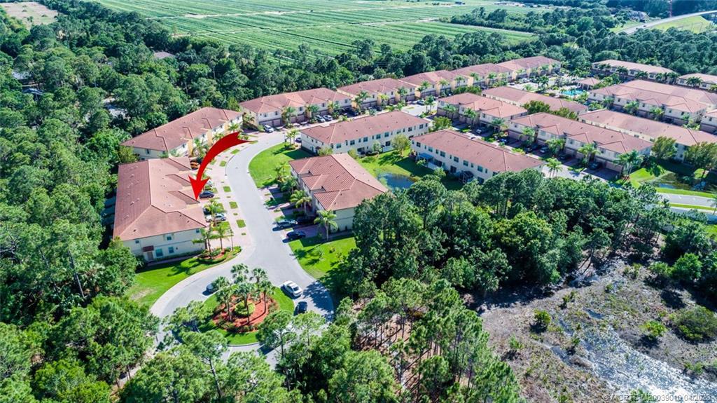 9726 Southwest Purple Martin Way Stuart, FL 34997 - Photo 3 of 30 an aerial view of residential houses with outdoor space and street view