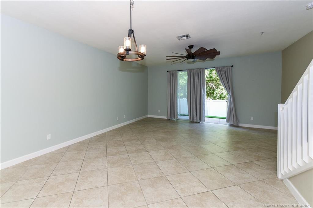 9726 Southwest Purple Martin Way Stuart, FL 34997 - Photo 10 of 30 a view of an entryway with chandelier
