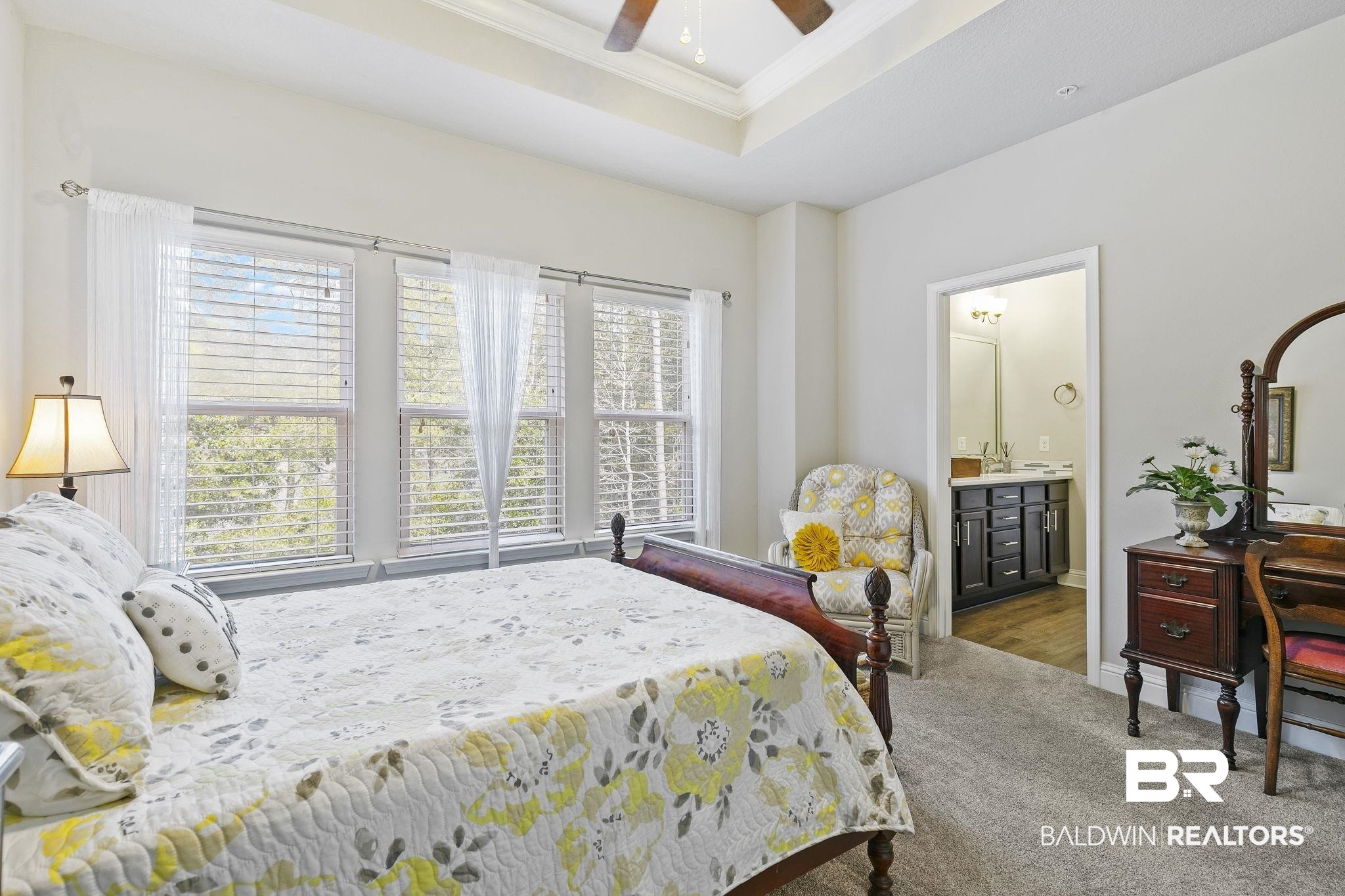 6867 Spaniel Drive, Unit B Daphne, AL 36527 - Photo 15 of 36 Bedroom featuring hardwood / wood-style floors, ensuite bathroom, a raised ceiling, crown molding, and ceiling fan