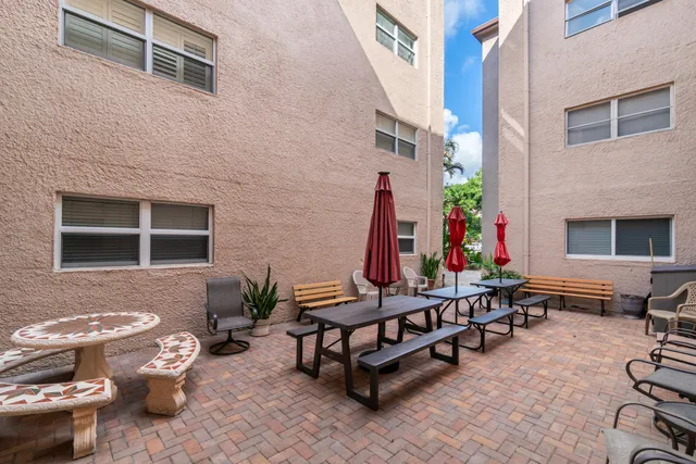 a kitchen with cabinets stainless steel appliances and a counter space