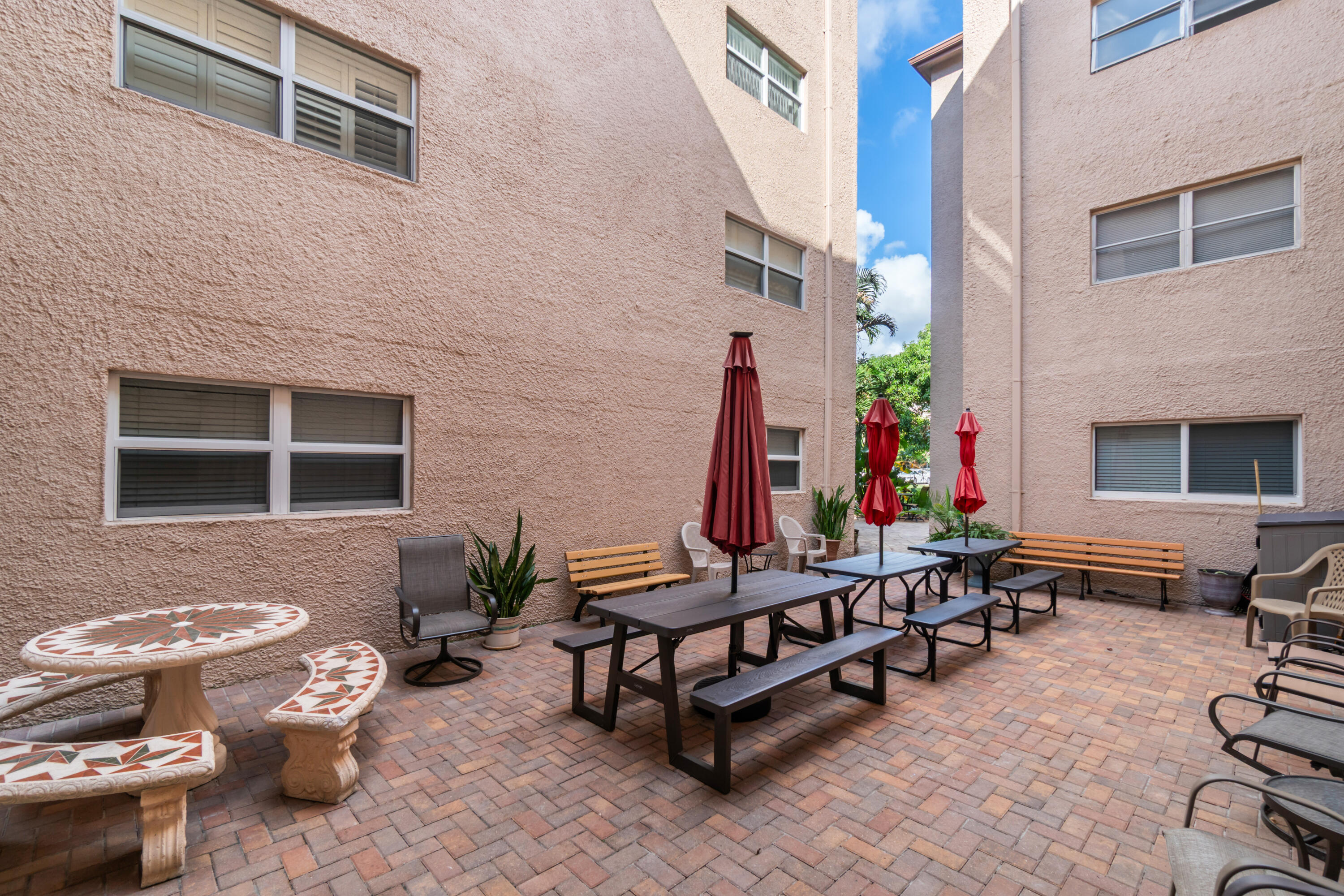 2615 Northeast 1st Court, Unit 303 Boynton Beach, FL 33435 - Photo 11 of 42 a outdoor space with lots of furniture and the couch