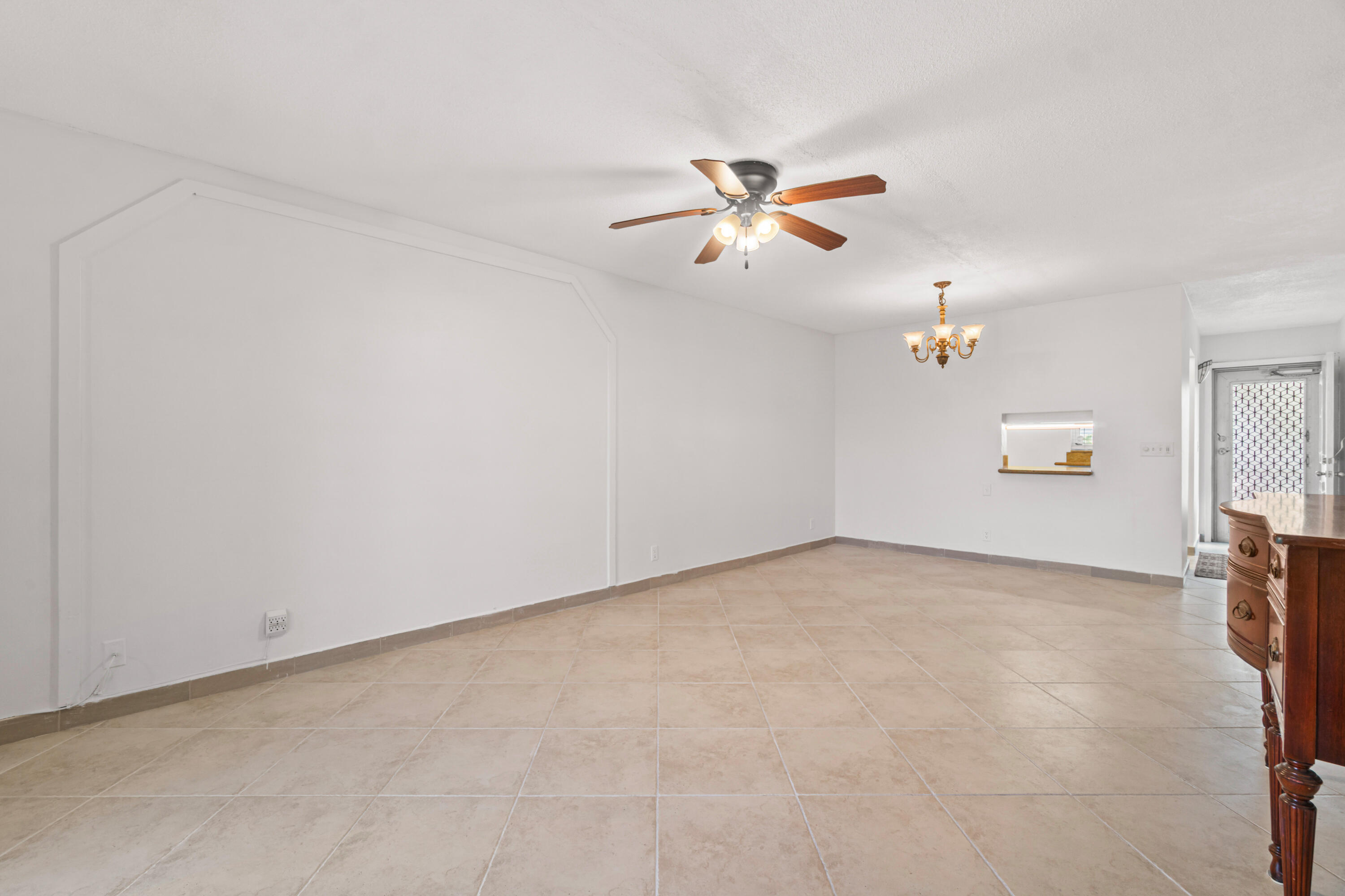 2615 Northeast 1st Court, Unit 303 Boynton Beach, FL 33435 - Photo 20 of 42 a view of a big room with carpet