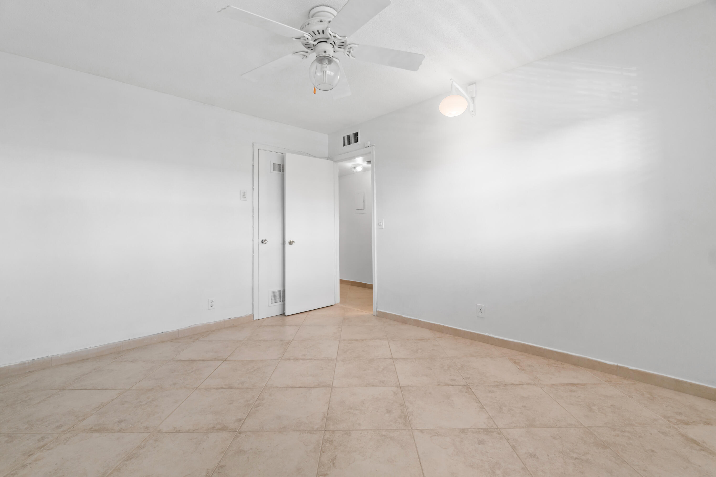2615 Northeast 1st Court, Unit 303 Boynton Beach, FL 33435 - Photo 27 of 42 wooden floor in an empty room