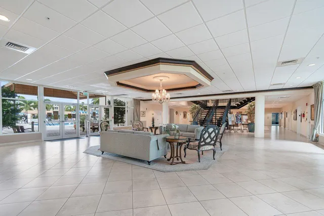 swimming pool view with a seating space