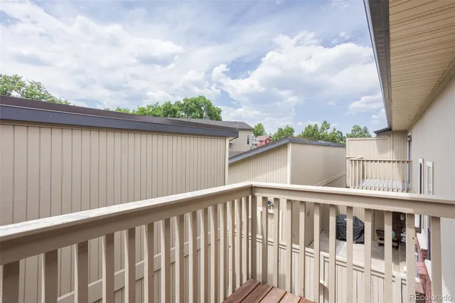 a view of a chair and table in the balcony