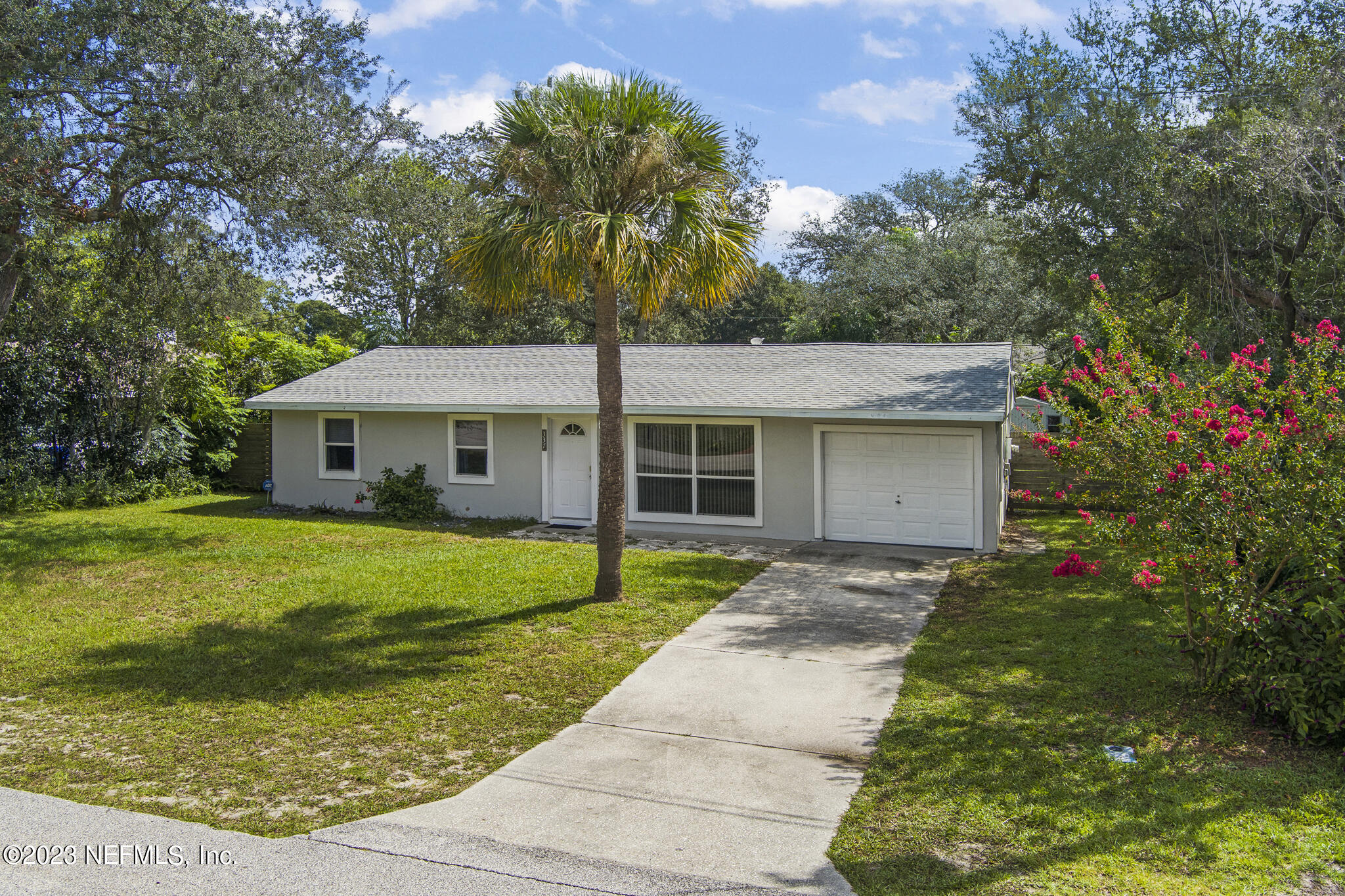 337 Jasmine Road St. Augustine, FL 32086 - Photo 1 of 37 a front view of a house with garden