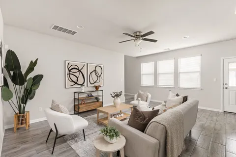 a living room with furniture and a window