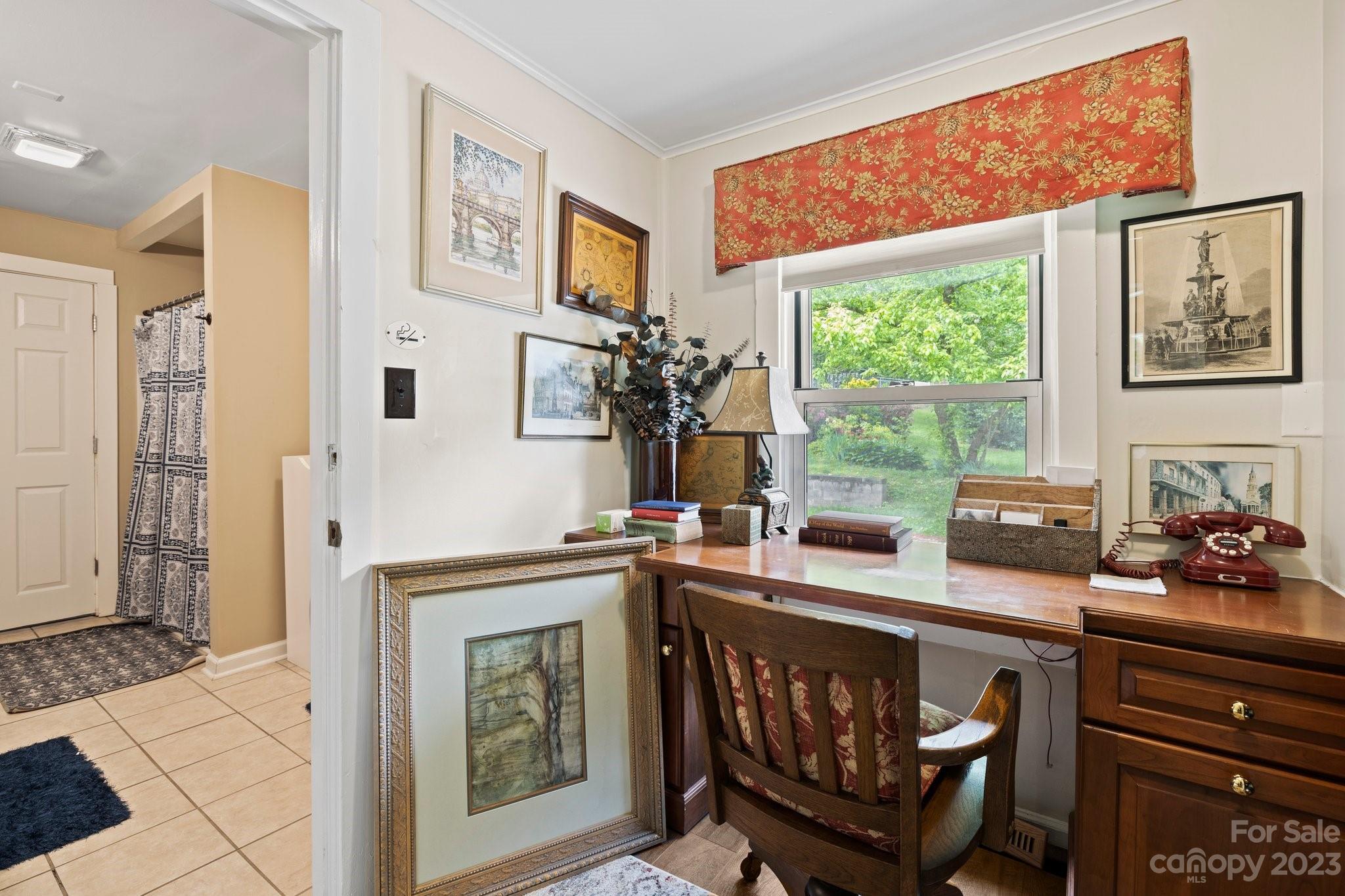 1545 Brevard Road Asheville, NC 28806 - Photo 15 of 43 a kitchen with a stove a refrigerator and a table