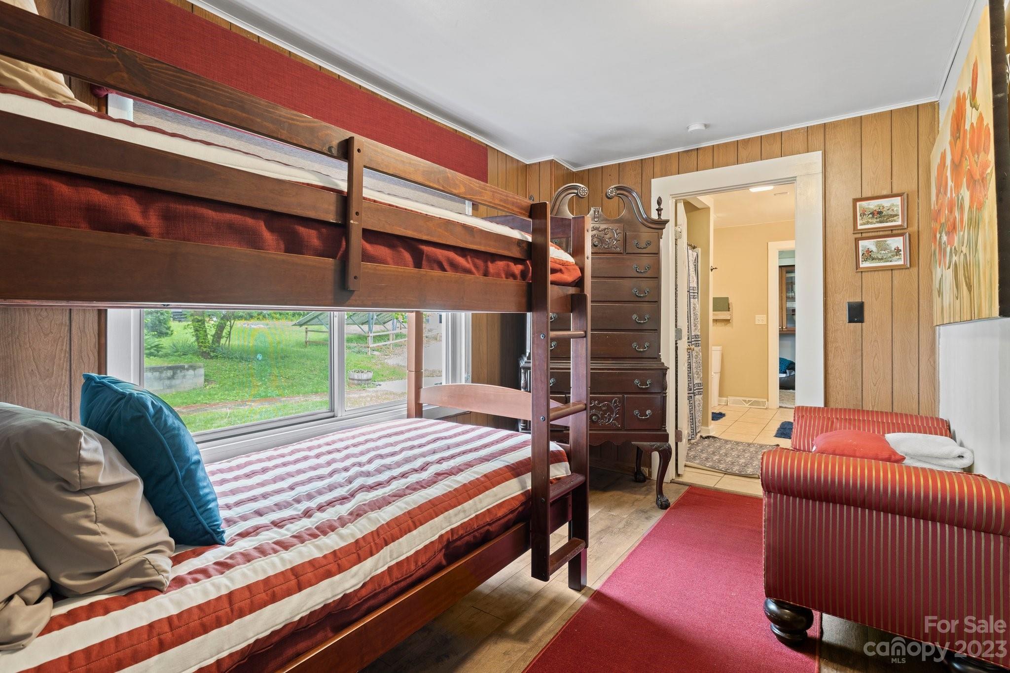 1545 Brevard Road Asheville, NC 28806 - Photo 16 of 43 a bedroom with furniture and a large window