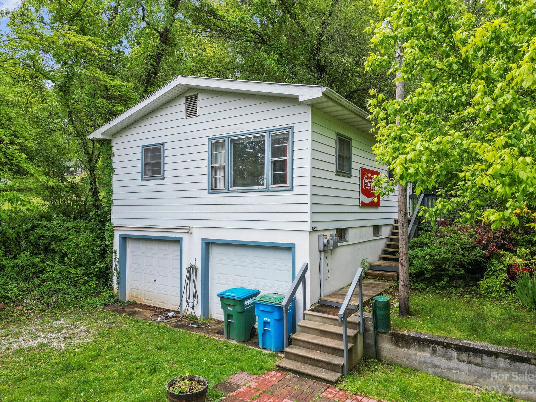 1545 Brevard Road Asheville, NC 28806 - Photo 24 of 43 a front view of a house with garden