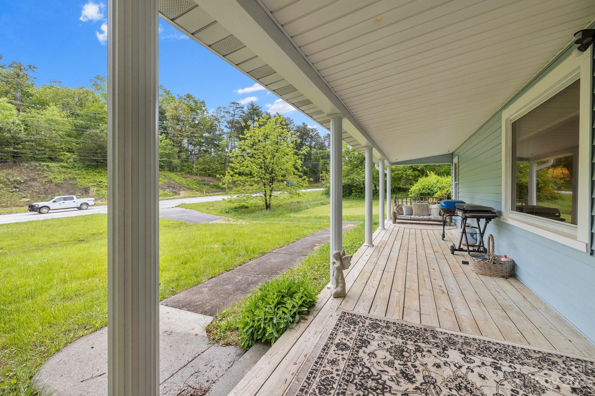 1545 Brevard Road Asheville, NC 28806 - Photo 3 of 43 a view of a porch with wooden floor and outdoor space