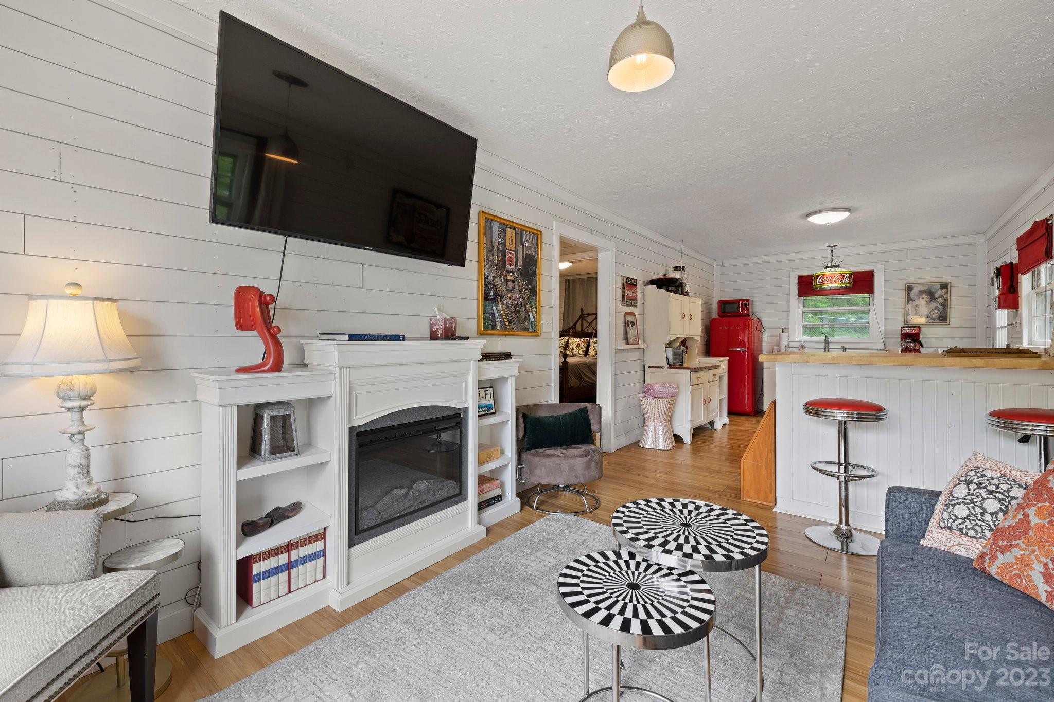 1545 Brevard Road Asheville, NC 28806 - Photo 31 of 43 a living room with furniture and a flat screen tv