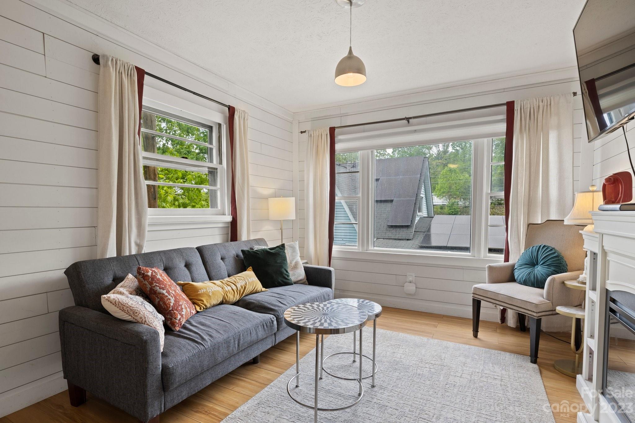 1545 Brevard Road Asheville, NC 28806 - Photo 32 of 43 a living room with furniture and a large window