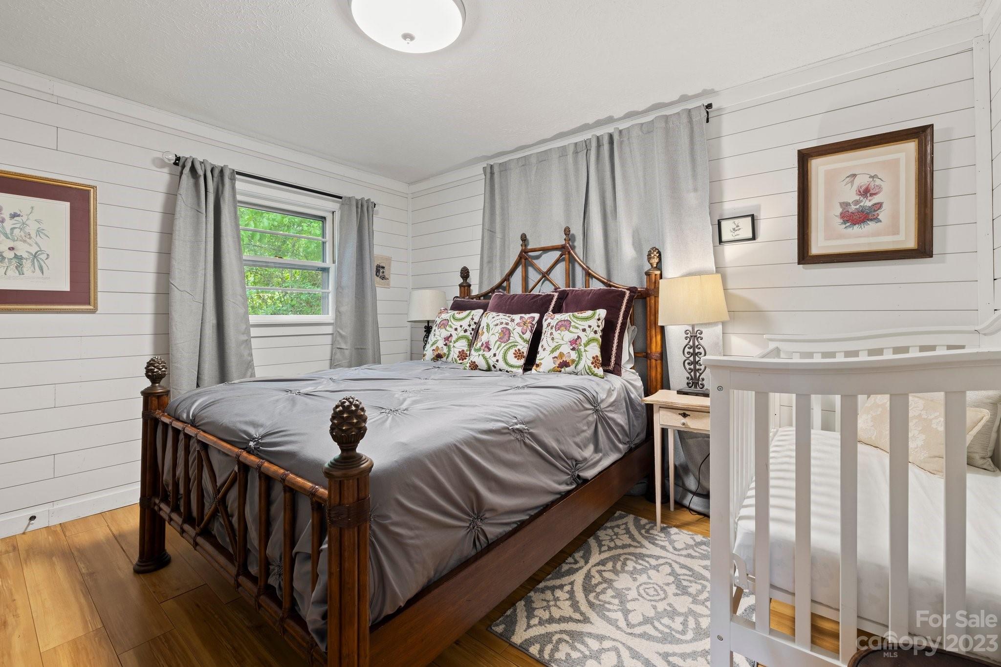 1545 Brevard Road Asheville, NC 28806 - Photo 35 of 43 a bedroom with a bed and a window