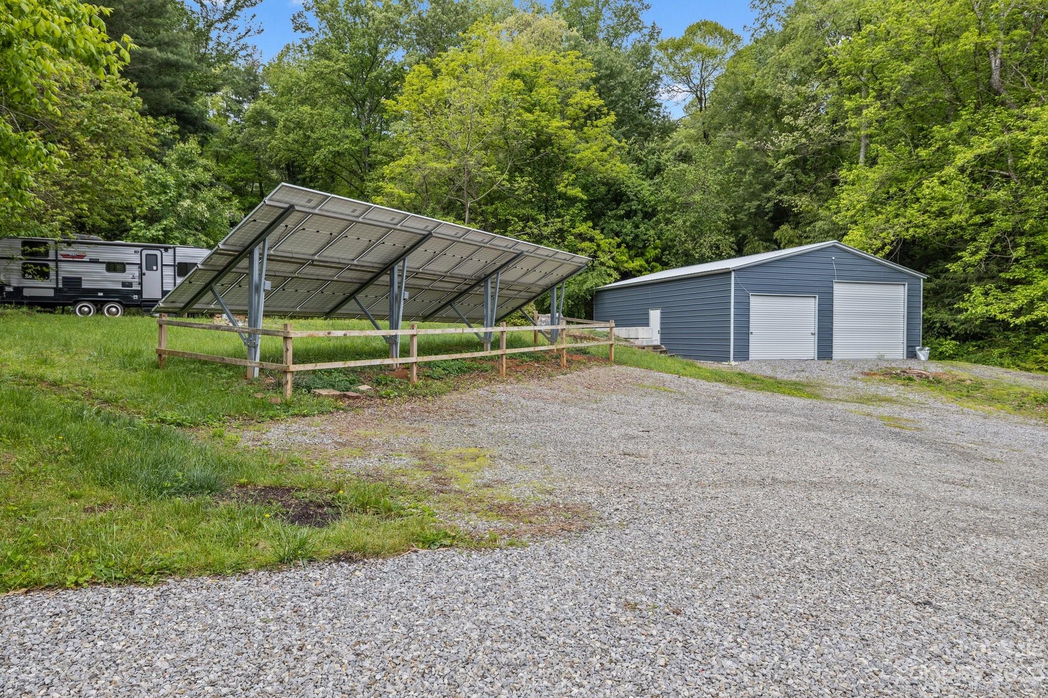 1545 Brevard Road Asheville, NC 28806 - Photo 38 of 43 a view of backyard with wooden fence and a large tree