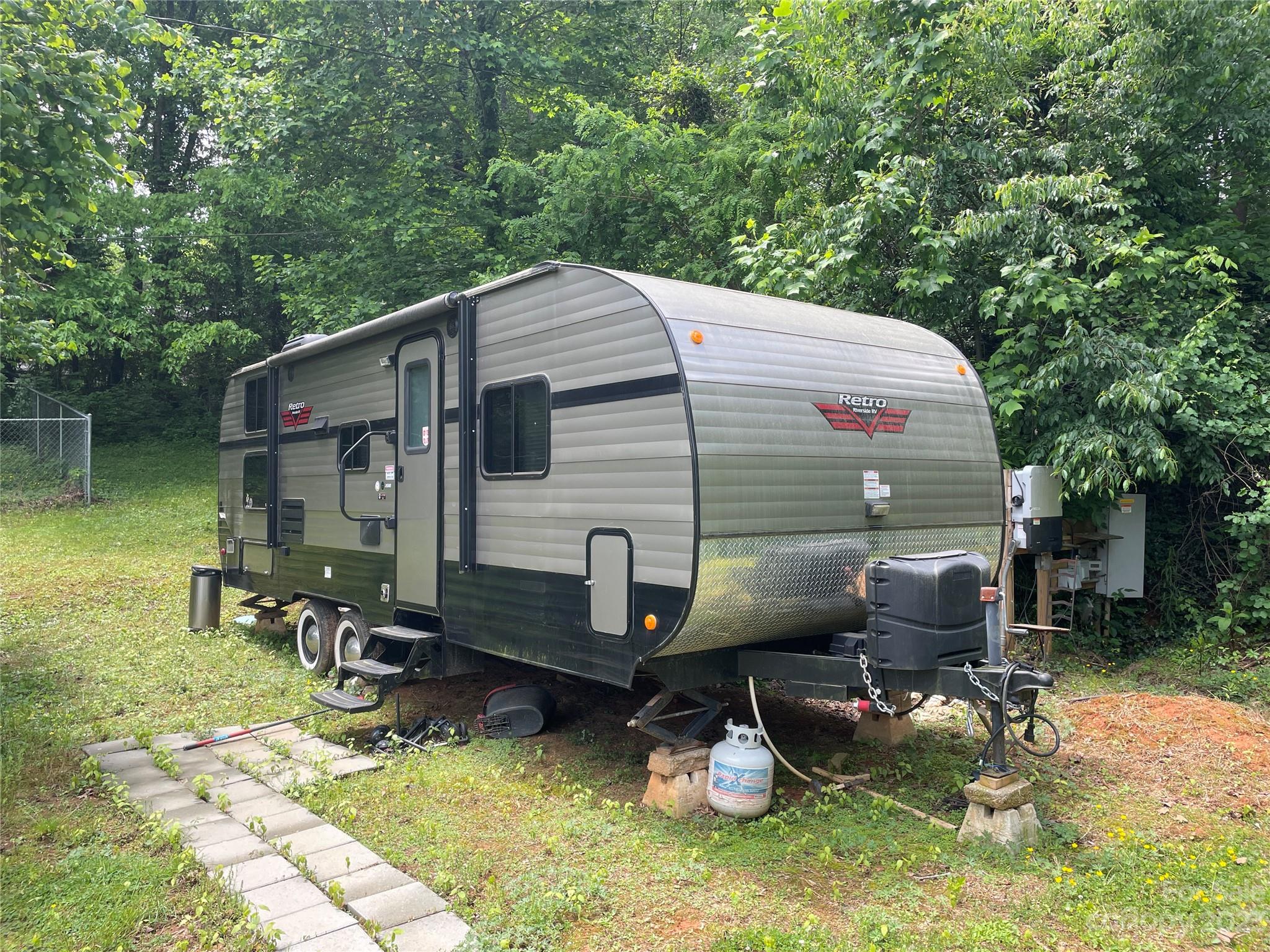 1545 Brevard Road Asheville, NC 28806 - Photo 40 of 43 a front view of a house with yard and sitting area