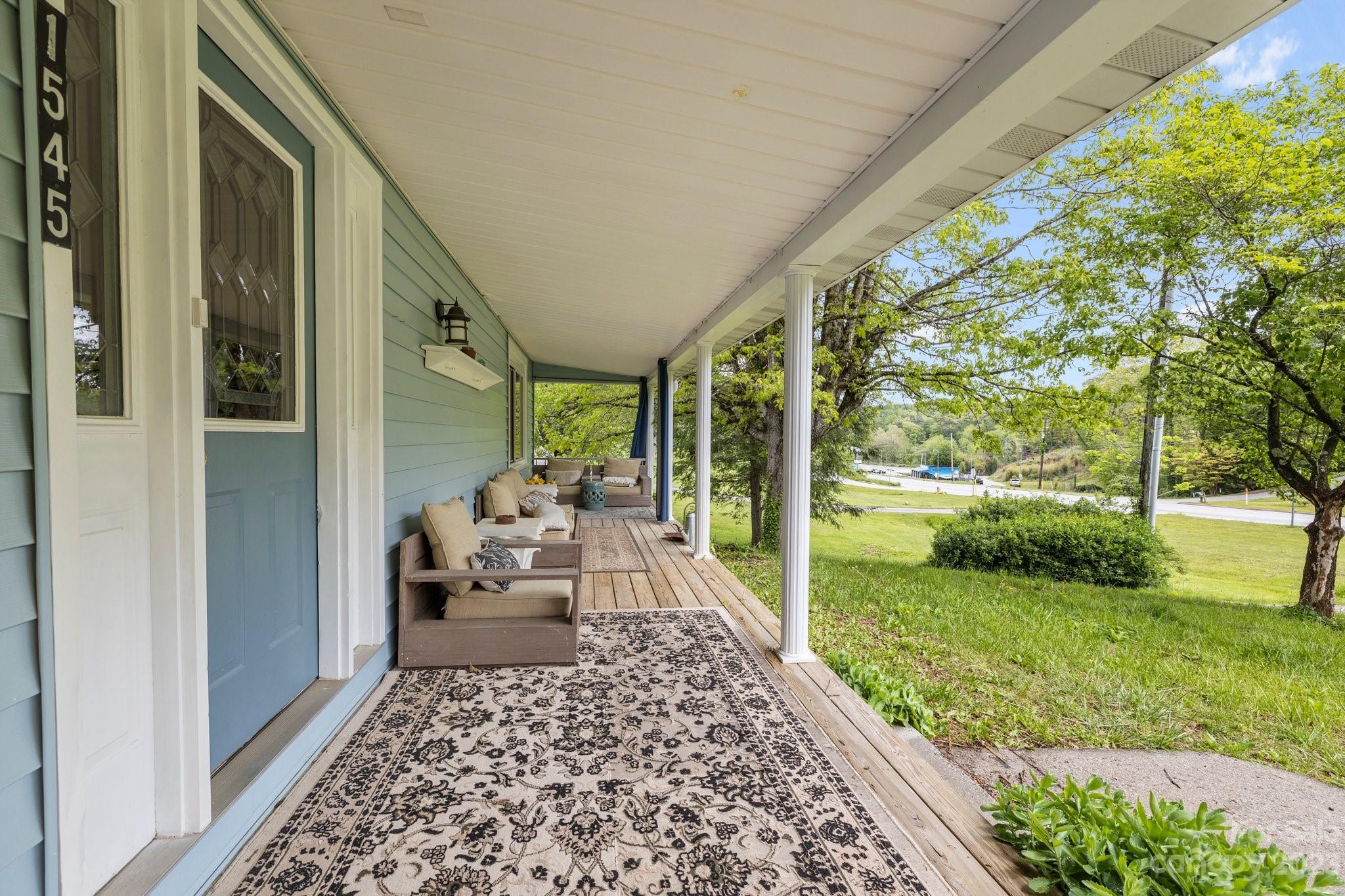 1545 Brevard Road Asheville, NC 28806 - Photo 4 of 43 a view of a porch with furniture and garden