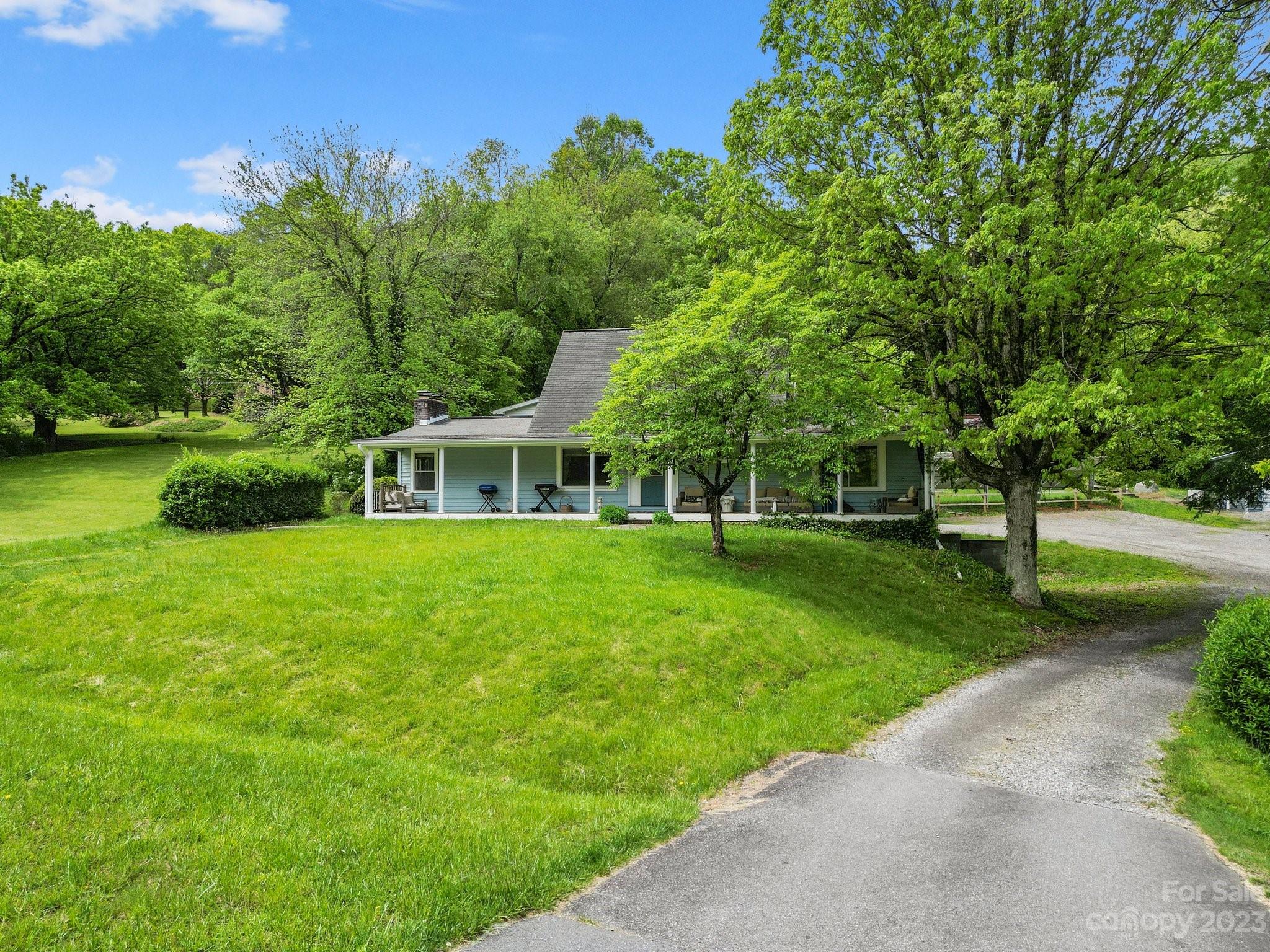 1545 Brevard Road Asheville, NC 28806 - Photo 5 of 43 a front view of a house with garden