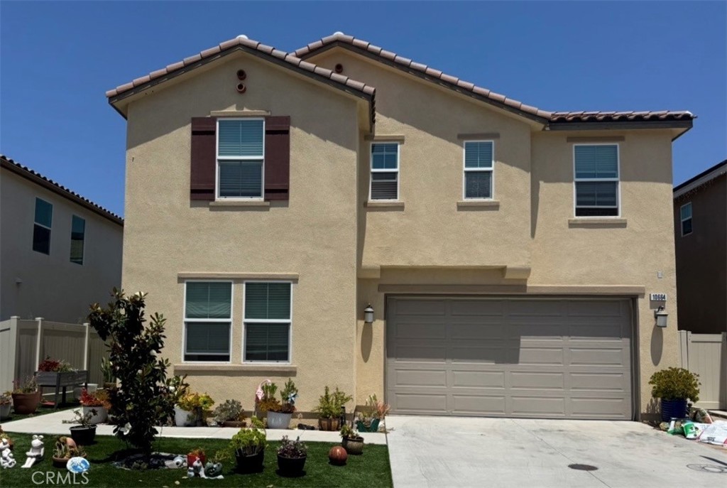 10664 Busch Street Spring Valley, CA 91978 - Photo 1 of 14 a front view of a house with a yard
