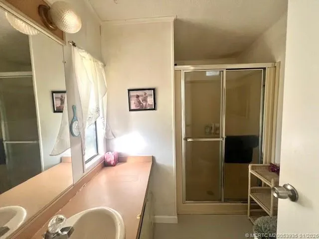 a bathroom with a sink and mirror