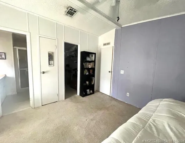 a view of a bedroom with closet
