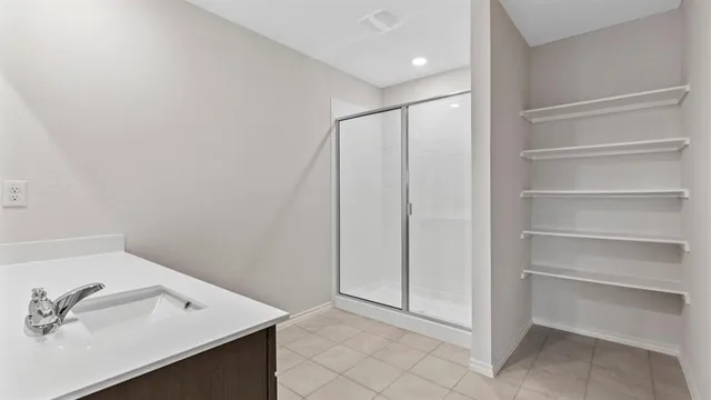a room with a sink cabinets and utility room
