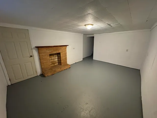 an empty room with a fireplace